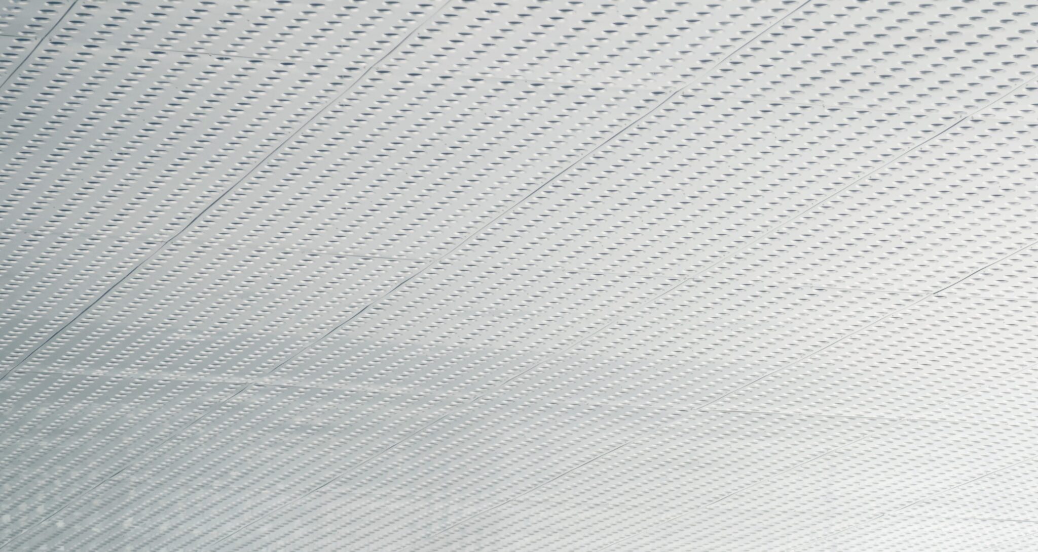 Ceiling of white panels with a pimple dotted effect