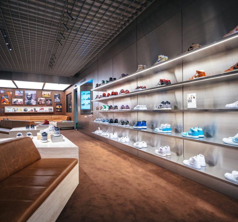 Shoe shop with shoes lining the walls and a wood floor